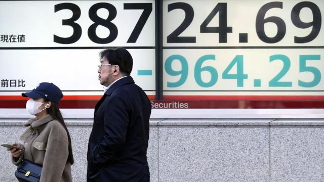 People stand in front of an electronic stock board showing Japan's Nikkei 225 index at a securities firm Monday, March 11, 2024, in Tokyo. Asian shares were mostly lower on Monday after Wall Street’s huge rally faltered last week. (AP Photo/Eugene Hoshiko) People stand in front of an electronic stock board showing Japan's Nikkei 225 index at a securities firm Monday, March 11, 2024, in Tokyo. Asian shares were mostly lower on Monday after Wall Street’s huge rally faltered last week. (AP Photo/Eugene Hoshiko)