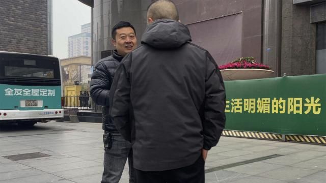 Plainclothes policemen have a chat as they stand watch outside the barricaded Sichuan Trust office building in Chengdu in southwestern China's Sichuan Province on Feb. 27, 2024. Some investors in a troubled trust fund in China are facing financial ruin under a government plan to return a fraction of their money, casualties of a slump in the property industry and a broader economic slowdown. (AP Photo/Andy Wong) Plainclothes policemen have a chat as they stand watch outside the barricaded Sichuan Trust office building in Chengdu in southwestern China's Sichuan Province on Feb. 27, 2024. Some investors in a troubled trust fund in China are facing financial ruin under a government plan to return a fraction of their money, casualties of a slump in the property industry and a broader economic slowdown. (AP Photo/Andy Wong)