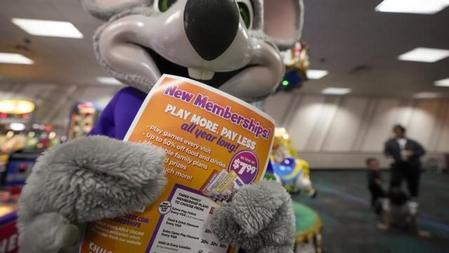 An employee dressed as Chuck E. Cheese holds a flyer advertising new memberships at a location Wednesday, March 13, 2024, in San Diego. Paid loyalty programs are all the rage in the restaurant and retail world. Looking for reliable sales in an unpredictable spending environment, more companies have extended their points-based loyalty tiers to making their most dependable customers feel valued for an up-front fee. (AP Photo/Gregory Bull) An employee dressed as Chuck E. Cheese holds a flyer advertising new memberships at a location Wednesday, March 13, 2024, in San Diego. Paid loyalty programs are all the rage in the restaurant and retail world. Looking for reliable sales in an unpredictable spending environment, more companies have extended their points-based loyalty tiers to making their most dependable customers feel valued for an up-front fee. (AP Photo/Gregory Bull)