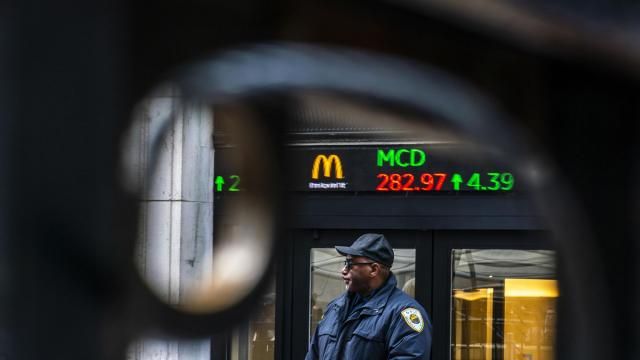 A Security member stands guard at one of the entrance of the New York Stock Exchange in New York, Tuesday, March 19, 2024. (AP Photo/Eduardo Munoz Alvarez) A Security member stands guard at one of the entrance of the New York Stock Exchange in New York, Tuesday, March 19, 2024. (AP Photo/Eduardo Munoz Alvarez)