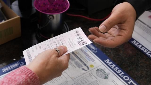 FILE - A customer purchases five Powerball tickets at a lottery agent, Tuesday, Oct. 10, 2023, in Haverhill, Mass. (AP Photo/Charles Krupa, File) FILE - A customer purchases five Powerball tickets at a lottery agent, Tuesday, Oct. 10, 2023, in Haverhill, Mass. (AP Photo/Charles Krupa, File)