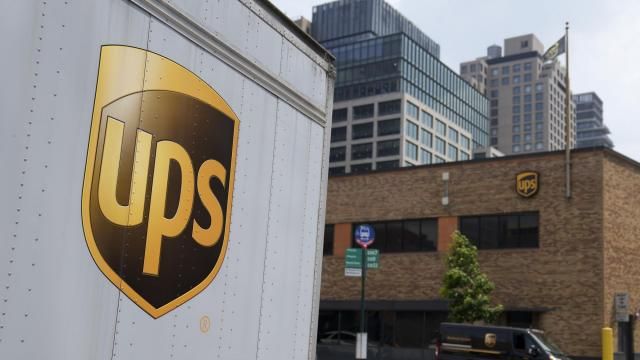 FILE - A delivery vehicle passes by a UPS depot, Thursday, June 29, 2023, in New York. UPS has received an air cargo contract from the United States Postal Service, significantly expanding on an existing partnership between the two. UPS said Monday, April 1, 2024, that it will become USPS's primary air cargo provider and move the majority of its air cargo in the U.S. following a transition period.(AP Photo/John Minchillo, File) FILE - A delivery vehicle passes by a UPS depot, Thursday, June 29, 2023, in New York. UPS has received an air cargo contract from the United States Postal Service, significantly expanding on an existing partnership between the two. UPS said Monday, April 1, 2024, that it will become USPS's primary air cargo provider and move the majority of its air cargo in the U.S. following a transition period.(AP Photo/John Minchillo, File)