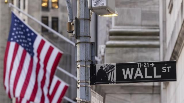 FILE - Signs at the intersection of Wall St. and Broad St. are shown outside the New York Stock Exchange, March. 21, 2024, in New York. (AP Photo/Yuki Iwamura, FILE) FILE - Signs at the intersection of Wall St. and Broad St. are shown outside the New York Stock Exchange, March. 21, 2024, in New York. (AP Photo/Yuki Iwamura, FILE)