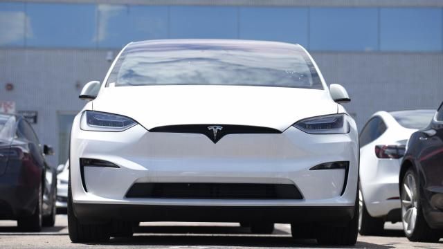 FILE - An Unsold 2023 Model X sports-utility vehicle sits outside a Tesla dealership Sunday, June 18, 2023, in Englewood, Colo. Tesla sales are expected to fall in the first quarter as demand for electric vehicles continues to slow. (AP Photo/David Zalubowski, File) FILE - An Unsold 2023 Model X sports-utility vehicle sits outside a Tesla dealership Sunday, June 18, 2023, in Englewood, Colo. Tesla sales are expected to fall in the first quarter as demand for electric vehicles continues to slow. (AP Photo/David Zalubowski, File)