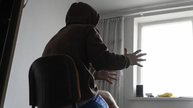 A Russian officer who goes by Yevgeny speaks during an interview at his apartment in Astana, Kazakhstan, in late 2023. He had a friend shoot him in the leg so he could get out off the frontline in Ukraine. "Many of my friends have died. And these were really good guys who didn't want to fight," he said. "But there was no way out for them." (AP Photo) A Russian officer who goes by Yevgeny speaks during an interview at his apartment in Astana, Kazakhstan, in late 2023. He had a friend shoot him in the leg so he could get out off the frontline in Ukraine. "Many of my friends have died. And these were really good guys who didn't want to fight," he said. "But there was no way out for them." (AP Photo)
