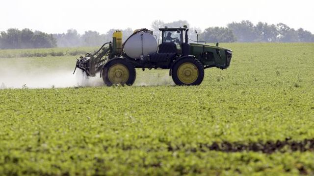 FILE - A soybean field is sprayed in Iowa, July 11, 2013. The maker of a popular weedkiller is turning to lawmakers in key states to try to squelch legal claims that it failed to warn about cancer risks. (AP Photo/Charlie Neibergall, File) FILE - A soybean field is sprayed in Iowa, July 11, 2013. The maker of a popular weedkiller is turning to lawmakers in key states to try to squelch legal claims that it failed to warn about cancer risks. (AP Photo/Charlie Neibergall, File)