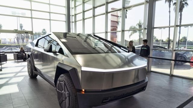A Tesla Cybertruck is on display at the Tesla showroom in Buena Park, Calif. on Sunday Dec. 3, 2023. Tesla is recalling 3,878 of its 2024 Cybertrucks after it discovered that the accelerator pedal can become stuck, potentially causing the vehicle to accelerate unintentionally and increasing the risk of a crash. (AP Photo/Richard Vogel)