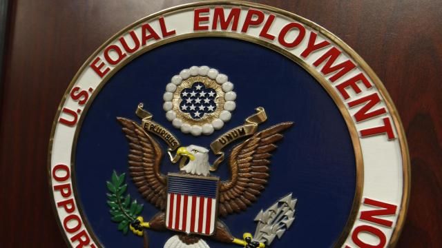 FILE - The emblem of the U.S. Equal Employment Opportunity Commission is shown on a podium in Vail, Colo., Tuesday, Feb. 16, 2016, in Denver. Pregnant workers have the right to a wide range of accommodations under new federal regulations for implementing the Pregnant Workers Fairness Act. The regulations take an expansive view of conditions related to pregnancy, from fertility treatments to abortion and post-childbirth complications. (AP Photo/David Zalubowski, File)