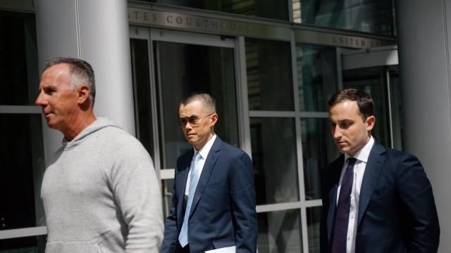 Changpeng Zhao, center, the billionaire founder of the giant cryptocurrency exchange Binance, leaves the federal courthouse in Seattle after he was sentenced to four months in prison on Tuesday, April 30, 2024. Zhao pleaded guilty in November 2023 to money-laundering violations. (Grant Hindsley/The New York Times)