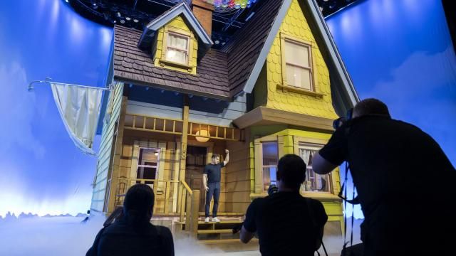 Brian Chesky, CEO of Airbnb, displays a replica of the house from the Pixar film “Up”, in Los Angeles, on May 1, 2024. The company announced a new category of outlandish stays in partnership with brands and celebrities, building on the success of gimmicks like the Barbie Malibu DreamHouse. (J. Emilio Flores/The New York Times)