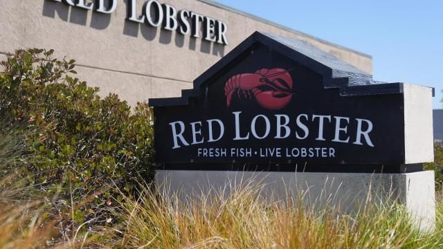 FILE - Signs for a Red Lobster restaurant are shown in San Bruno, Calif., Tuesday, May 14, 2024. Red Lobster has filed for Chapter 11 bankruptcy protection days after shuttering dozens of restaurants. The seafood chain has been struggling for some time with lease and labor costs piling up in recent years and also promotions like its iconic all-you-can-eat shrimp deal. (AP Photo/Jeff Chiu, File)