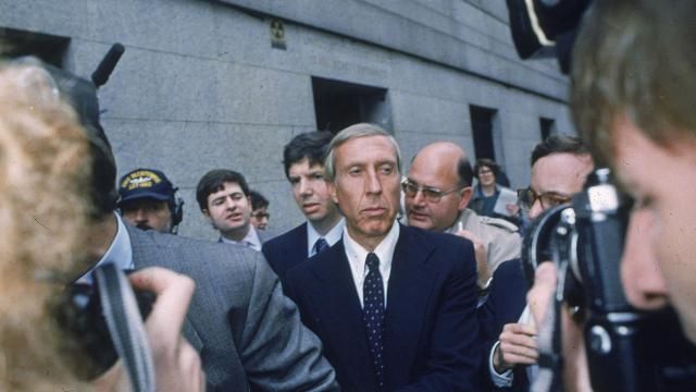 FILE - Ivan F. Boesky, center, leaves federal court in New York, April 24, 1987 after pleading guilty to one count of violating federal securities laws. Boesky, the flamboyant stock speculator whose cooperation with the government cracked open one of the largest insider trading scandals on Wall Street, has died at the age of 87. (AP Photo/G. Paul Burnett, File)