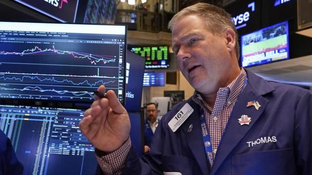 Trader Thomas McCauley works on the floor of the New York Stock Exchange, Friday, May 9, 2025. (AP Photo/Richard Drew)