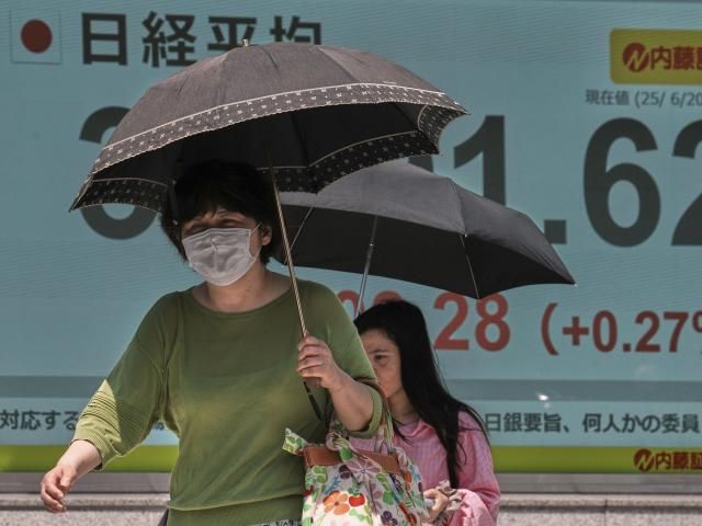 Asian shares are mixed and oil gains as world waits to see if US will join Israel's war against Iran
