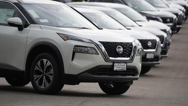 FILE - Unsold 2021 Rogue sports-utility vehicles sit on a lot at a Nissan dealership Colorado on June 27, 2021. (AP Photo/David Zalubowski, File)