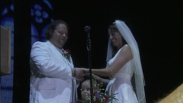 Couple wed on concert stage