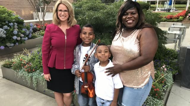 Tyler Butler-Figueroa and his family pose with Debra Morgan