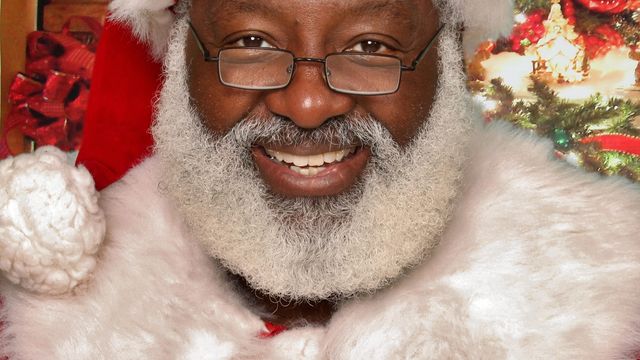 Local photographer finds a Santa of color for families