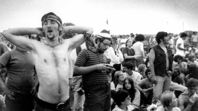 FILE - Music fans relax during a break in the entertainment at the Woodstock Music and Arts Fair, Aug. 16, 1969, in Bethel, N.Y. An estimated 450,000 people attended the Woodstock festival in August 1969, and most of that crowd was composed of teenagers or young adults now in the twilight of their lives. That ticking clock is why the Museum at Bethel Woods, based at the site of the festival, is immersed in a five-year project traveling around the United States recording the oral histories of people were there, preserving the Woodstock memories before they fade away. (AP Photo, File) FILE - Music fans relax during a break in the entertainment at the Woodstock Music and Arts Fair, Aug. 16, 1969, in Bethel, N.Y. An estimated 450,000 people attended the Woodstock festival in August 1969, and most of that crowd was composed of teenagers or young adults now in the twilight of their lives. That ticking clock is why the Museum at Bethel Woods, based at the site of the festival, is immersed in a five-year project traveling around the United States recording the oral histories of people were there, preserving the Woodstock memories before they fade away. (AP Photo, File)