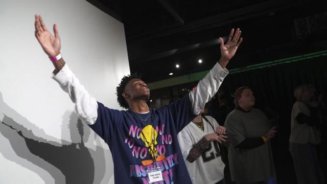Jeremiah Manley, left, and other attendees at The Cove, an 18-and-up, pop-up Christian nightclub, raise their arms in worship on Saturday, Feb. 17, 2024, in Nashville, Tenn. The Cove was started last year by seven Black Christian men in their 20s who sought to build a thriving community and a welcoming space for young adults outside houses of worship. (AP Photo/Jessie Wardarski) Jeremiah Manley, left, and other attendees at The Cove, an 18-and-up, pop-up Christian nightclub, raise their arms in worship on Saturday, Feb. 17, 2024, in Nashville, Tenn. The Cove was started last year by seven Black Christian men in their 20s who sought to build a thriving community and a welcoming space for young adults outside houses of worship. (AP Photo/Jessie Wardarski)