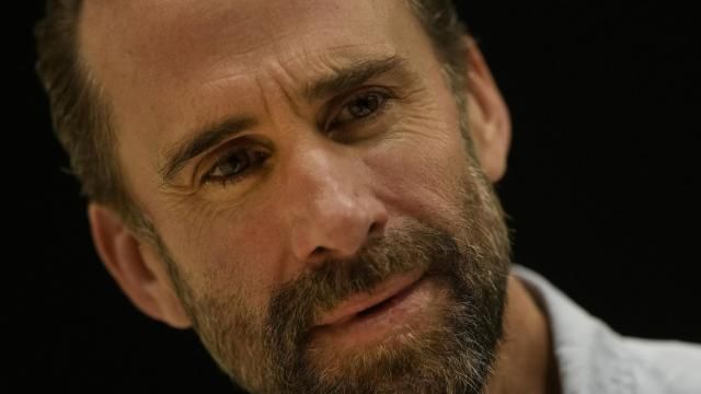 FILE - Actor Joseph Fiennes looks at writer James Graham on stage as they look at the script for the play based around the England soccer manager Gareth Southgate entitled 'Dear England' at the productions rehearsal studio in London, Sept. 20, 2023. An acclaimed revival of Andrew Lloyd Webber’s “Sunset Boulevard” and a play about the travails of England’s national soccer team lead the race for the Olivier Awards recognizing work on the London stage. James Graham’s “Dear England” got nine nominations including best new play and best actor for Joseph Fiennes. Winners will be announced April 14 in a ceremony at London’s Royal Albert Hall. (AP Photo/Alastair Grant, File) FILE - Actor Joseph Fiennes looks at writer James Graham on stage as they look at the script for the play based around the England soccer manager Gareth Southgate entitled 'Dear England' at the productions rehearsal studio in London, Sept. 20, 2023. An acclaimed revival of Andrew Lloyd Webber’s “Sunset Boulevard” and a play about the travails of England’s national soccer team lead the race for the Olivier Awards recognizing work on the London stage. James Graham’s “Dear England” got nine nominations including best new play and best actor for Joseph Fiennes. Winners will be announced April 14 in a ceremony at London’s Royal Albert Hall. (AP Photo/Alastair Grant, File)