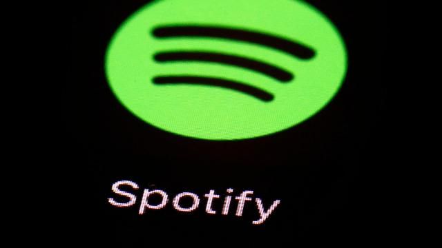 FILE - The Spotify app is displayed on an iPad in Baltimore, March 20, 2018. Since late last century and the early days of the web, providers of digital media like Netflix and Spotify have had a free pass when it comes to international taxes on films, video games and music that are shipped across borders through the internet. But now, a global consensus on the issue may be starting to crack. (AP Photo/Patrick Semansky, File) FILE - The Spotify app is displayed on an iPad in Baltimore, March 20, 2018. Since late last century and the early days of the web, providers of digital media like Netflix and Spotify have had a free pass when it comes to international taxes on films, video games and music that are shipped across borders through the internet. But now, a global consensus on the issue may be starting to crack. (AP Photo/Patrick Semansky, File)