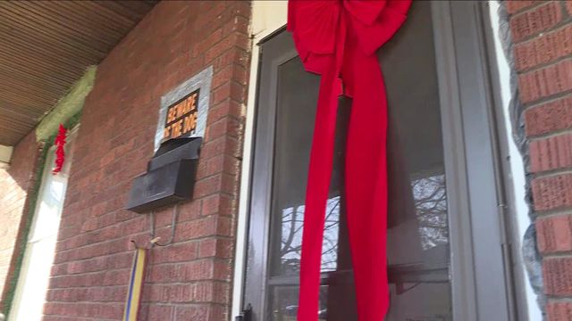 Paid in full: Santa delivers deed to foreclosed home