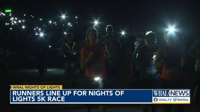 Runners line up for Nights of Lights 5K race 
