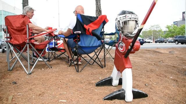 Carolina Hurricanes fans tailgate before a playoff game against the New Jersey Devils in April 2025.