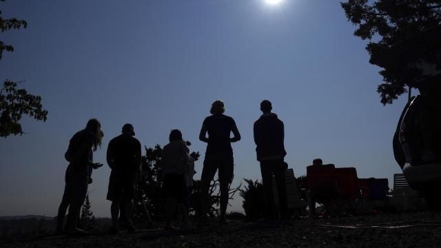 FILE - People gather near Redmond, Ore., to view the sun as it nears a total eclipse by the moon, Monday, Aug. 21, 2017. The April 8, 2024 total solar eclipse in North America first hits land at Mexico’s Pacific coast, cuts diagonally across the U.S. from Texas to Maine and exits in eastern Canada. (AP Photo/Ted S. Warren, File) FILE - People gather near Redmond, Ore., to view the sun as it nears a total eclipse by the moon, Monday, Aug. 21, 2017. The April 8, 2024 total solar eclipse in North America first hits land at Mexico’s Pacific coast, cuts diagonally across the U.S. from Texas to Maine and exits in eastern Canada. (AP Photo/Ted S. Warren, File)