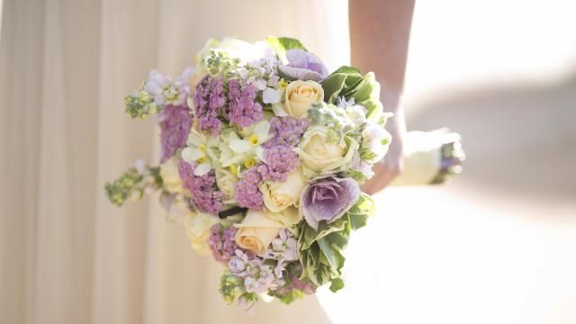 FILE - A bride holds a bouquet during her wedding in Ein Hemed, Israel on Dec. 14, 2017. The Marriage Pact is an annual matching ritual that has become a popular staple on nearly 90 college campuses around the country. About 500,000 students have done the pact since it first rolled out at Stanford University in 2017. (AP Photo/Ariel Schalit, File) FILE - A bride holds a bouquet during her wedding in Ein Hemed, Israel on Dec. 14, 2017. The Marriage Pact is an annual matching ritual that has become a popular staple on nearly 90 college campuses around the country. About 500,000 students have done the pact since it first rolled out at Stanford University in 2017. (AP Photo/Ariel Schalit, File)