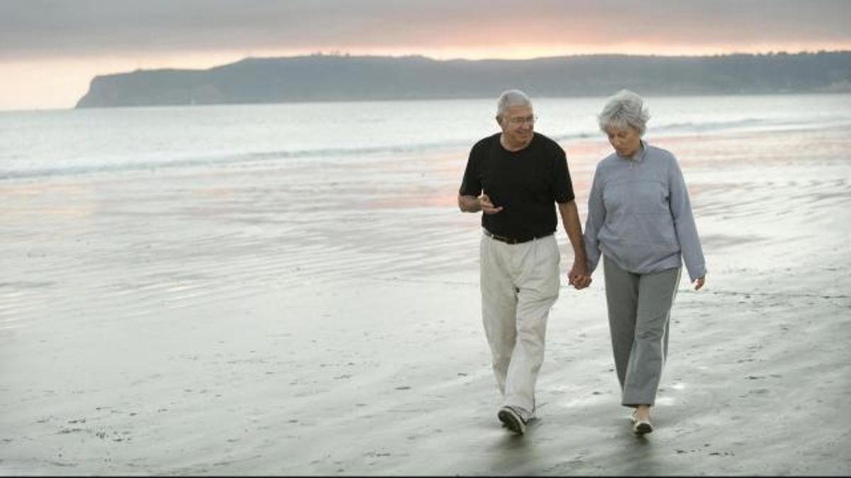 Seniors Walking The Beach
