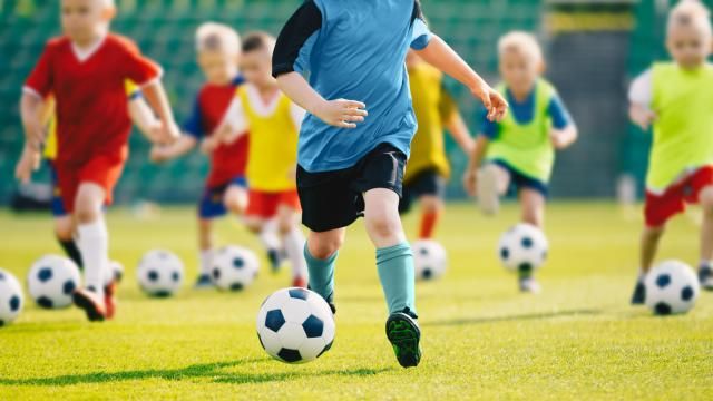 Children playing soccer (Adobe Stock)