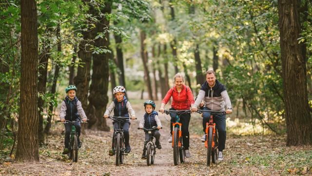 Family biking on a trail (Adobe Stock) Family biking on a trail (Adobe Stock)