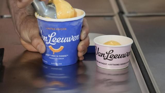 Ben Van Leeuwen scoops Kraft Mac &amp; Cheese flavored ice cream Wednesday, May 15, 2024, in the Brooklyn borough of New York. Kraft Heinz approached New York-based artisanal ice cream maker Van Leeuwen a few years ago about macaroni and cheese-flavored ice cream. (AP Photo/Frank Franklin II)