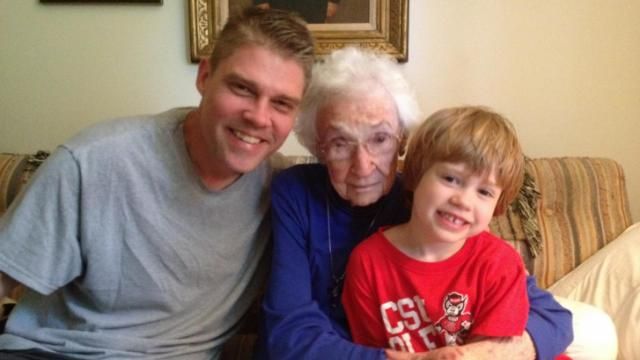 Julia Sims' husband and son with beloved neighbor 