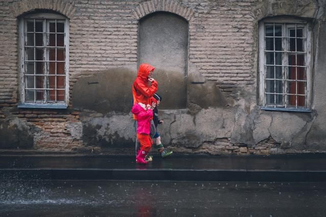 Family walk in the rain