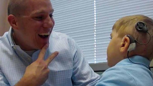 Triangle boy receives trial implant, hears for first time