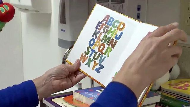 Program gifts books at doctors to help kids build reading habit