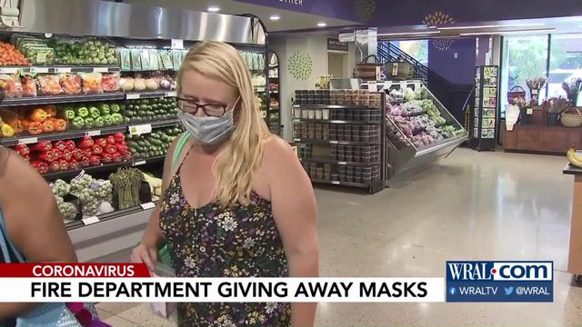 Raleigh firefighters handing out masks to the public