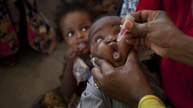 FILE-- In this file photo, a Somali baby receives a polio vaccine, at the Medina Maternal Child Health center in Mogadishu, Somalia. Zimbabwe has started an emergency campaign to inoculate more than 4 million children against polio after health authorities detected 3 cases caused by a rare mutation of the weakened virus used in oral vaccines, including a 10-year-old girl who was paralyzed in January. (AP Photo/Ben Curtis, File) FILE-- In this file photo, a Somali baby receives a polio vaccine, at the Medina Maternal Child Health center in Mogadishu, Somalia. Zimbabwe has started an emergency campaign to inoculate more than 4 million children against polio after health authorities detected 3 cases caused by a rare mutation of the weakened virus used in oral vaccines, including a 10-year-old girl who was paralyzed in January. (AP Photo/Ben Curtis, File)
