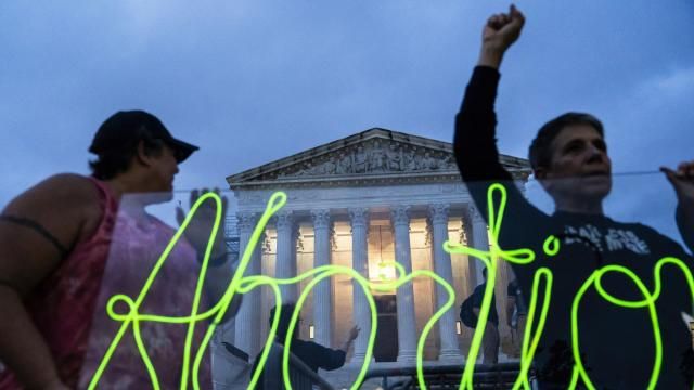 FILE - Activists mark the first anniversary of the Supreme Court's decision in Dobbs v. Jackson Women's Health Organization, by displaying neon signage in support of abortion access in front of the Supreme Court on June 23, 2023, in Washington. A report finds the total number of monthly abortions in the U.S. increased after state bans started kicking in in 2022. (AP Photo/Nathan Howard, File) FILE - Activists mark the first anniversary of the Supreme Court's decision in Dobbs v. Jackson Women's Health Organization, by displaying neon signage in support of abortion access in front of the Supreme Court on June 23, 2023, in Washington. A report finds the total number of monthly abortions in the U.S. increased after state bans started kicking in in 2022. (AP Photo/Nathan Howard, File)