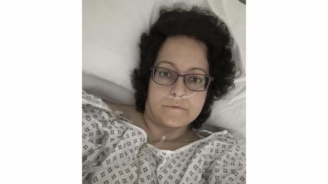 This July 2023 self-portrait provided by Anna Gittins shows the elementary school principal from Hereford in western England in a hospital bed during her cancer treatment. Gittins was shocked when she found out she had advanced colorectal cancer in 2022. But when she contacted her local hospital, she was told no one would be able to see her for three months "due to high demand and low capacity of senior doctors." Gittins had access to private health care and has since undergone surgery and chemotherapy. (Anna Gittins via AP) This July 2023 self-portrait provided by Anna Gittins shows the elementary school principal from Hereford in western England in a hospital bed during her cancer treatment. Gittins was shocked when she found out she had advanced colorectal cancer in 2022. But when she contacted her local hospital, she was told no one would be able to see her for three months "due to high demand and low capacity of senior doctors." Gittins had access to private health care and has since undergone surgery and chemotherapy. (Anna Gittins via AP)