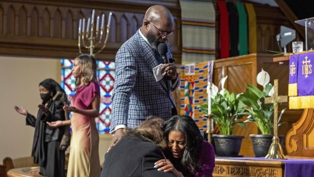 Rev. William H. Lamar IV, top, and Rev. Cozette Thomas, right, pray with a parishioner during Palm Sunday services at the Metropolitan AME Church in Washington, Sunday, March 24, 2024. Lamar says their churches are still feeling the pandemic’s impact on attendance, even as they have rolled out robust online worship options to reach people. (AP Photo/Amanda Andrade-Rhoades) Rev. William H. Lamar IV, top, and Rev. Cozette Thomas, right, pray with a parishioner during Palm Sunday services at the Metropolitan AME Church in Washington, Sunday, March 24, 2024. Lamar says their churches are still feeling the pandemic’s impact on attendance, even as they have rolled out robust online worship options to reach people. (AP Photo/Amanda Andrade-Rhoades)