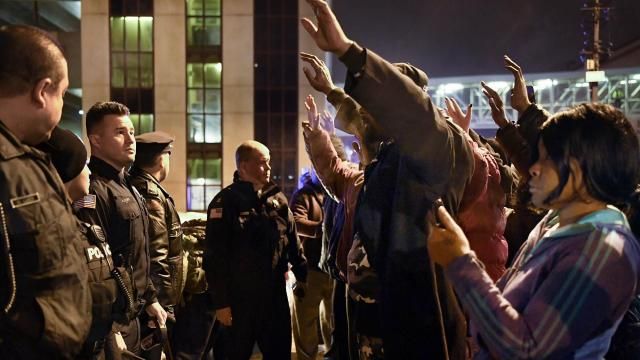 Protesters raise their hands as they face police officers during a rally in Paterson, N.J., Tuesday, Jan. 8, 2019, in reaction to the death of Jameek Lowery. Lowery, 27, who recorded a frantic video at police headquarters, wound up unresponsive after being taken to a hospital in an ambulance with police officers inside. He died two days later. (Danielle Parhizkaran/The Record via AP) Protesters raise their hands as they face police officers during a rally in Paterson, N.J., Tuesday, Jan. 8, 2019, in reaction to the death of Jameek Lowery. Lowery, 27, who recorded a frantic video at police headquarters, wound up unresponsive after being taken to a hospital in an ambulance with police officers inside. He died two days later. (Danielle Parhizkaran/The Record via AP)