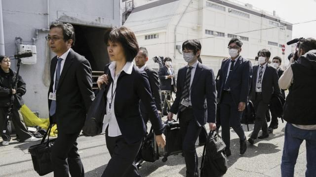 Japan's health ministry officials walk towards the Osaka plant of Kobayashi Pharmaceutical Co. to conduct an on-site inspection in Osaka, western Japan, Saturday, March 30, 2024. Japanese government health officials raided a factory Saturday producing health supplements that they say have killed multiple people and hospitalized more than 100 others. Japan's health ministry officials walk towards the Osaka plant of Kobayashi Pharmaceutical Co. to conduct an on-site inspection in Osaka, western Japan, Saturday, March 30, 2024. Japanese government health officials raided a factory Saturday producing health supplements that they say have killed multiple people and hospitalized more than 100 others.