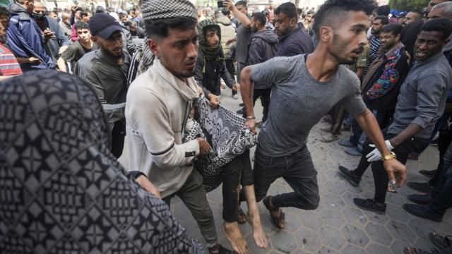 Palestinians carry a wounded person following an Israeli airstrike near the Al Aqsa hospital in Deir al Balah, Gaza Strip, Sunday, March 31, 2024. (AP Photo/Abdel Kareem Hana) Palestinians carry a wounded person following an Israeli airstrike near the Al Aqsa hospital in Deir al Balah, Gaza Strip, Sunday, March 31, 2024. (AP Photo/Abdel Kareem Hana)