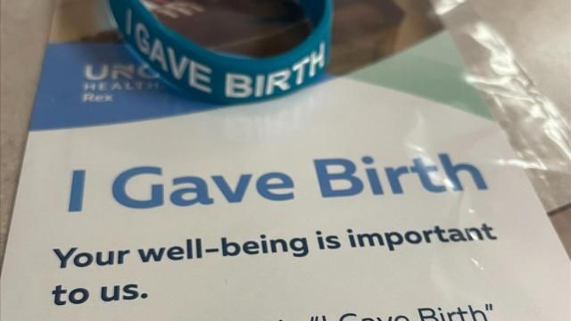 Blue bracelets with the words ‘I Gave Birth’ are being given to each woman who delivers a child at Rex Women’s Center in Raleigh.