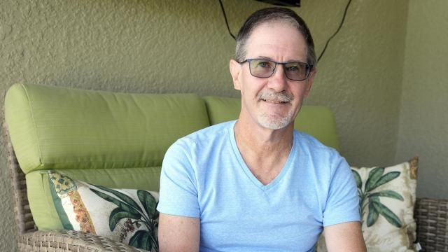 Scott Berkheiser, 57, who has Alzheimer's disease, sits for a portrait at his home Friday, April 5, 2024, in Venice, Fla. Insurance denials delayed Berkheiser’s first Leqembi infusion a few months until last December. He said the drugmaker eventually agreed to give it to him for free while he makes co-payments for the infusions. “It was a little crazy,” he said. “It seemed like it was kind of a game that must make sense for some monetary reason.” (AP Photo/Chris O'Meara) Scott Berkheiser, 57, who has Alzheimer's disease, sits for a portrait at his home Friday, April 5, 2024, in Venice, Fla. Insurance denials delayed Berkheiser’s first Leqembi infusion a few months until last December. He said the drugmaker eventually agreed to give it to him for free while he makes co-payments for the infusions. “It was a little crazy,” he said. “It seemed like it was kind of a game that must make sense for some monetary reason.” (AP Photo/Chris O'Meara)