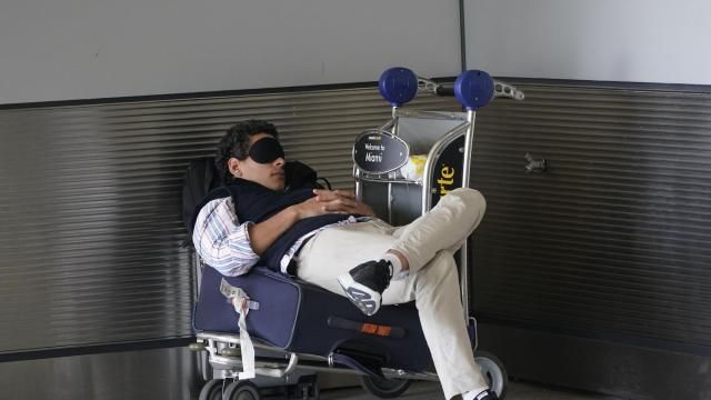 FILE - A traveler takes a nap as he waits for a ride outside Miami International Airport, Friday, July 1, 2022, in Miami. The Gallup survey, released Monday, April 15, 2024, says that a majority of Americans say they would feel better if they could have more sleep. But in the U.S., where the ethos of grinding and pulling yourself up by your own bootstraps is ubiquitous, getting enough sleep can seem like a dream. (AP Photo/Wilfredo Lee, File) FILE - A traveler takes a nap as he waits for a ride outside Miami International Airport, Friday, July 1, 2022, in Miami. The Gallup survey, released Monday, April 15, 2024, says that a majority of Americans say they would feel better if they could have more sleep. But in the U.S., where the ethos of grinding and pulling yourself up by your own bootstraps is ubiquitous, getting enough sleep can seem like a dream. (AP Photo/Wilfredo Lee, File)